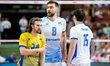Yaroslav Pampushko, Dmytro Yanchuk, and Vitalii Shchytkov play during a volleyball game be...