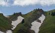 A summit cross stands on Hochgrat mountain along the Panoramic Loop Trail in Oberstaufen,...