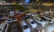 Traffic builds up near the city market ahead of Eid al-Fitr in Doha, Qatar, on May 26, 202...
