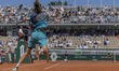 Andrey Rublev returns the ball against Camilo Ugo Carabelli during the Roland Garros Grand...