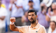Novak Djokovic reacts after winning his men's singles match against Valentin Royer on day...