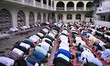 Nepali Muslims gather to perform Eid al-Adha prayers at a mosque in Kathmandu, Nepal, on M...