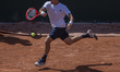 Yibing Wu returns the ball against Flavio Cobolli during the Roland Garros Grand Slam Tour...