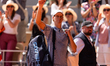 Jannik Sinner waves as he leaves the court after losing his men's singles match against Ju...