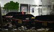 Damage to multiple Immigration and Customs Enforcement (ICE) vehicles, trash on the ground...