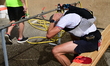 Athletes splash each other during the 92km Pilat Trail race in Veranne, France, on May 30,...