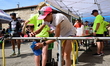Athletes splash each other during the 92km Pilat Trail race in Veranne, France, on May 30,...