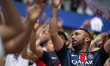 Fans arrive at the Puskas Arena ahead of the UEFA Champions League Final between Paris Sai...