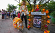 Pet owners dress their animals in colorful costumes as they participate in the ''Furries d...