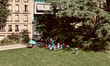 People relax and cool off under the shade at Montsouris Park during a heatwave in Paris, F...