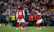 Arsenal and Paris Saint-Germain players compete for possession during the closing stages o...