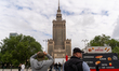 Spectators watch from the streets below as Estonian slackliner Jaan Roose crosses a highli...