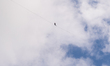Estonian slackliner Jaan Roose walks on a highline suspended between the Palace of Culture...