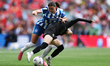 Charlie Rule of Brighton & Hove Albion tackles Yui Hasegawa of Manchester City during the...