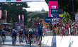 Italy's Jonathan Milan (R) celebrates after winning the 21st and final stage of the 109th...