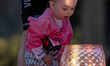 Jonas Vingegaard of Denmark and Team Visma | Lease a Bike, with his son and daughter, cele...