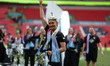 Laura Coombs of Manchester City celebrates with the top of the FA Cup Trophy following the...