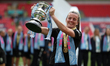 Lauren Hemp of Manchester City lifts the trophy following the team's victory in the Adobe...