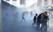 Protesters attempt to break the fences during a national strike organized by the National...