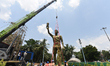 Public Works Department (PWD) authorities dismantle and remove a 70-foot fiberglass statue...
