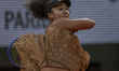 Naomi Osaka returns the ball against Aryna Sabalenka at the Roland Garros Grand Slam Tourn...