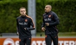Noa Lang and Donyell Malen of the Netherlands participate in a training session and press...