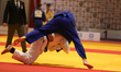 Wiktor Jankowski (in blue) and Patryk Broniec (in white) compete during a match at the 70t...