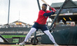 Victor Arias of the New Hampshire Fisher-Cats warms up before a Minor League Baseball game...