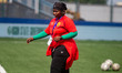 Guinea's coach walks off the pitch during Nigeria's U-17 women's national team, the Flamin...