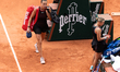 Aryna Sabalenka leaves the court after losing her women's singles match against Diana Shna...