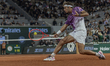 Flavio Cobolli returns the ball against Felix Auger-Aliassime during the Roland Garros Gra...