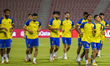 Yemen national team players warm up during a training session at Grand Hamad Stadium in Do...