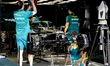 Mechanics work on the car of Formula 1 driver Lance Stroll of the Aston Martin Aramco Form...