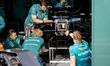 Mechanics work on the car of Formula 1 driver Fernando Alonso of the Aston Martin Aramco F...