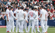 Josh Tongue of England and teammates celebrate the wicket of Glenn Phillips during the 1st...