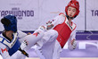 Yu-jin Kim of South Korea competes against Ella Brewster of Canada during the semi-finals...
