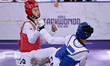 Yu-jin Kim of South Korea competes against Ella Brewster of Canada during the semi-finals...