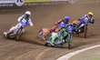 Patryk Dudek of Poland in red leads Max Fricke of Australia in blue, Anders Thomsen of Den...