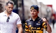 Formula 1 driver Lando Norris of the McLaren Mastercard Formula 1 Team with his security g...