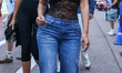 Kim and Khloe Kardashian in a pitlane prior to the qualifying session ahead of the Formula...