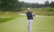 Marcel Schneider of Germany plays his second shot from the fairway of the 16th hole during...