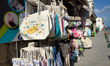A souvenir shop display with Cyprus-themed bags and tourist items is seen on a street in c...
