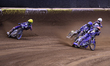 Brady Kurtz (101) of Australia in yellow goes wide, leading Bartosz Zmarzlik (95) of Polan...