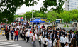 Students queue to enter the examination center of Taicang Senior High School for the colle...