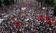 An aerial view shows a large crowd of protesters gathered outside the Prime Minister's Off...