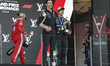 Kimi Antonelli of Italy and the Mercedes-AMG Petronas F1 Team stands with Toto Wolff, team...