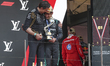 Kimi Antonelli of Italy and the Mercedes-AMG Petronas F1 Team stands with Toto Wolff, team...