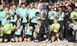 Kimi Antonelli of Italy and the Mercedes-AMG Petronas F1 Team celebrates with the team aft...