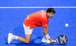 Agustin Tapia of Argentina competes against Alejandro Galan of Spain and Federico Chingott...