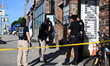 NYPD crime scene unit investigators search for clues at the scene where a 41-year-old man...